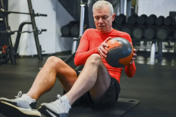 Muscle Building - Old man doing exercise