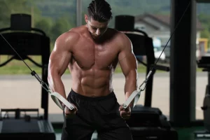 Muscular man doing chest exercise