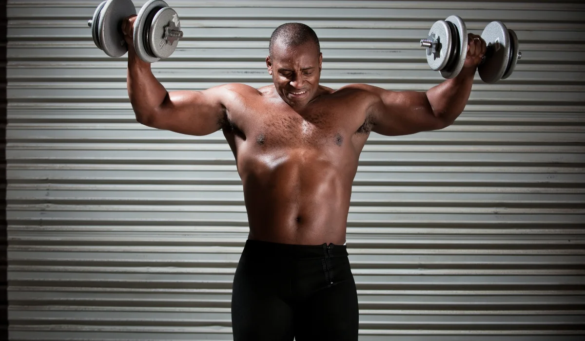 Muscular Man lifting dumbbell 